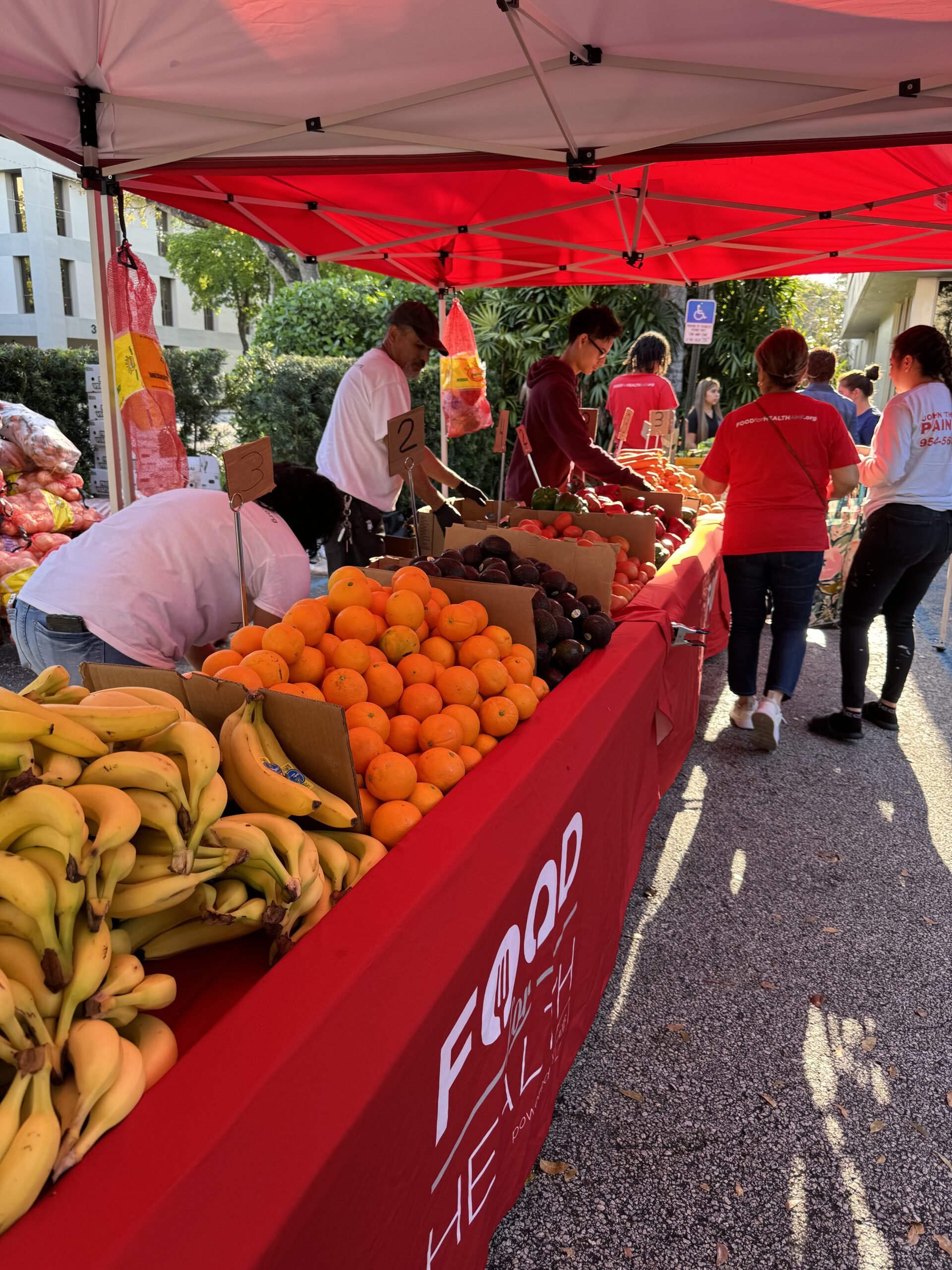 Fort Lauderdale community members picking up groceries from AHF Food For Health